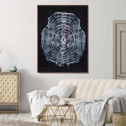 Monochrome tree ring cross-section on black background, showing detailed growth lines, perfect for modern rustic or minimalist interiors. (