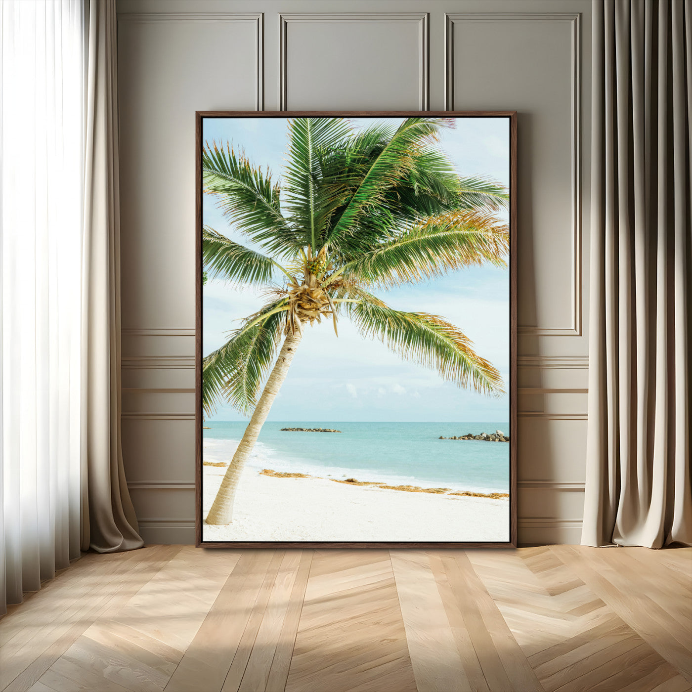 A tall palm tree leaning over a white sandy beach with turquoise ocean waves, creating a peaceful and tropical coastal scene.