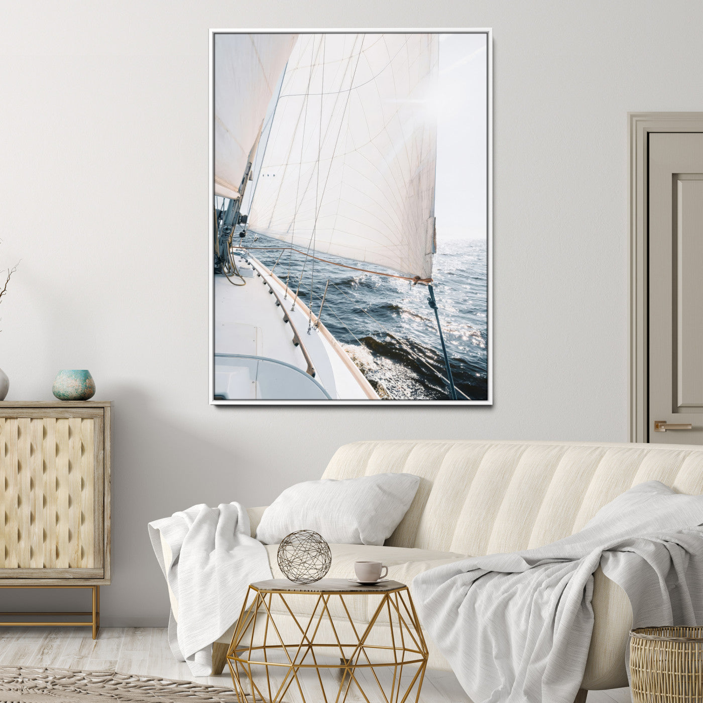 Canvas of a sailboat gliding on a sunlit ocean with white sails and sparkling water, ideal for coastal minimalist or nautical-style home decor.