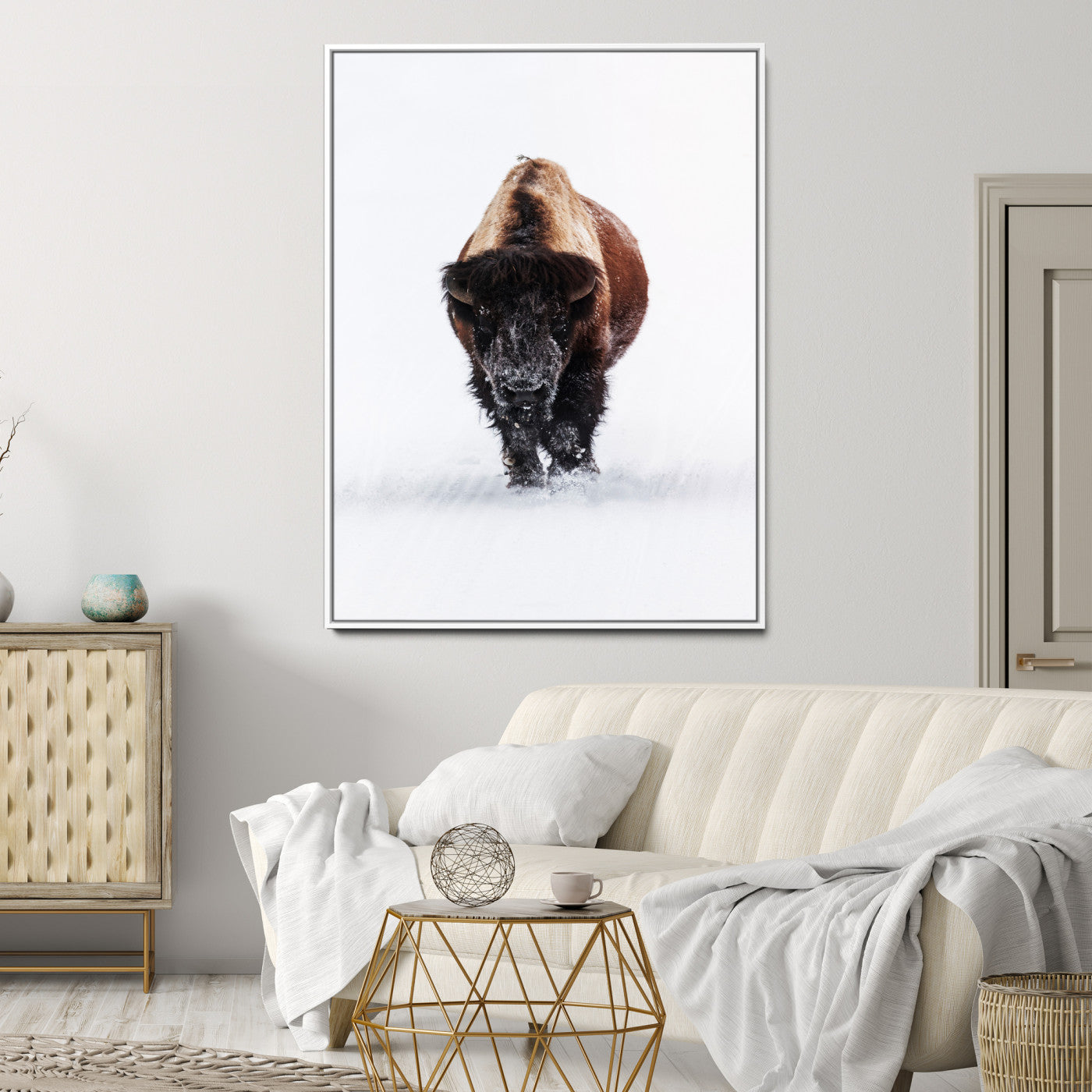 Front view of a strong bison walking in deep snow, isolated white background, perfect for rustic or lodge-style home decor.
