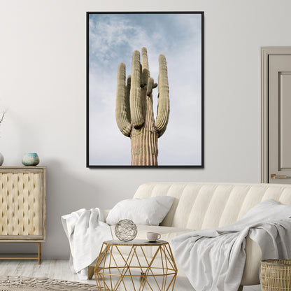 Vertical photo of a tall saguaro cactus against a soft sky, ideal for earthy or Southwestern home decor with warm neutral tones.