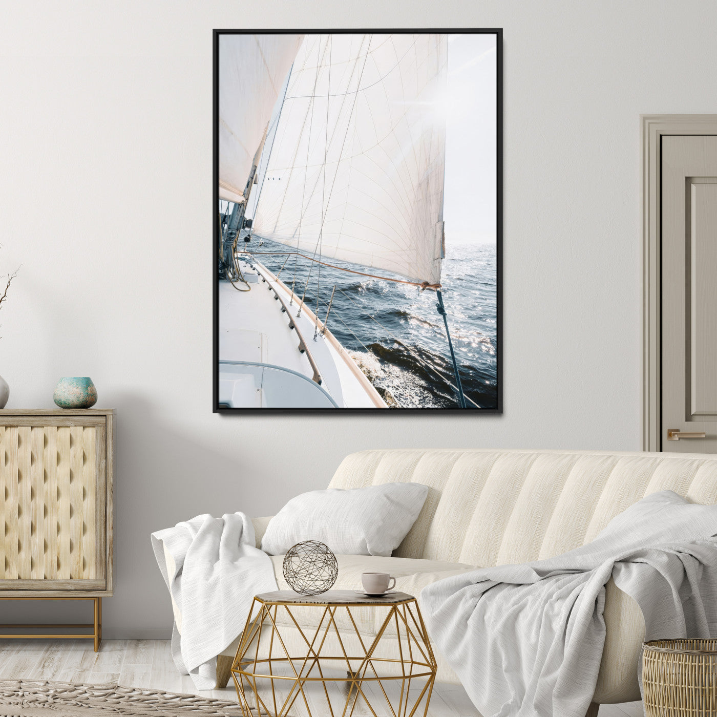 Canvas of a sailboat gliding on a sunlit ocean with white sails and sparkling water, ideal for coastal minimalist or nautical-style home decor.