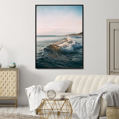 Close-up of ocean waves rolling gently toward the shore at sunset, creating a peaceful and minimalist coastal scene.