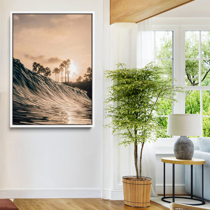Golden sunset view of an ocean wave curling near palm trees, radiating warm tones perfect for coastal or tropical-themed decor.