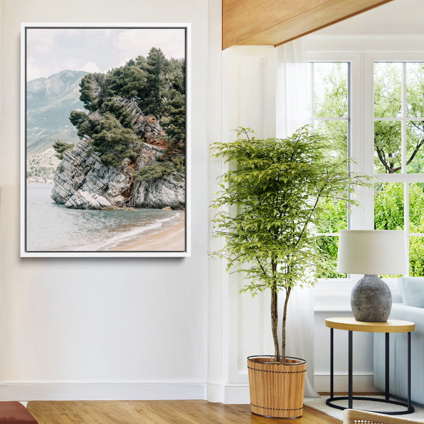 Framed photo of a rocky coastal cliff with dense greenery and calm shoreline, ideal for rustic coastal or earthy-toned home decor.