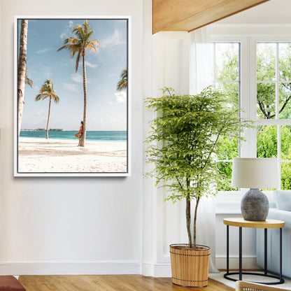 Person leaning on a palm tree at a tropical beach with white sand and turquoise water, perfect for coastal or beach-themed home decor.