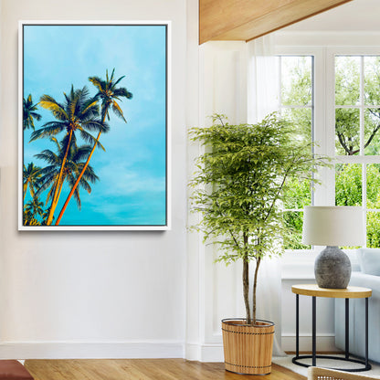"Tall palm trees with golden sunlight against a vibrant blue sky, creating a tropical, relaxing atmosphere for coastal and beach-themed decor.