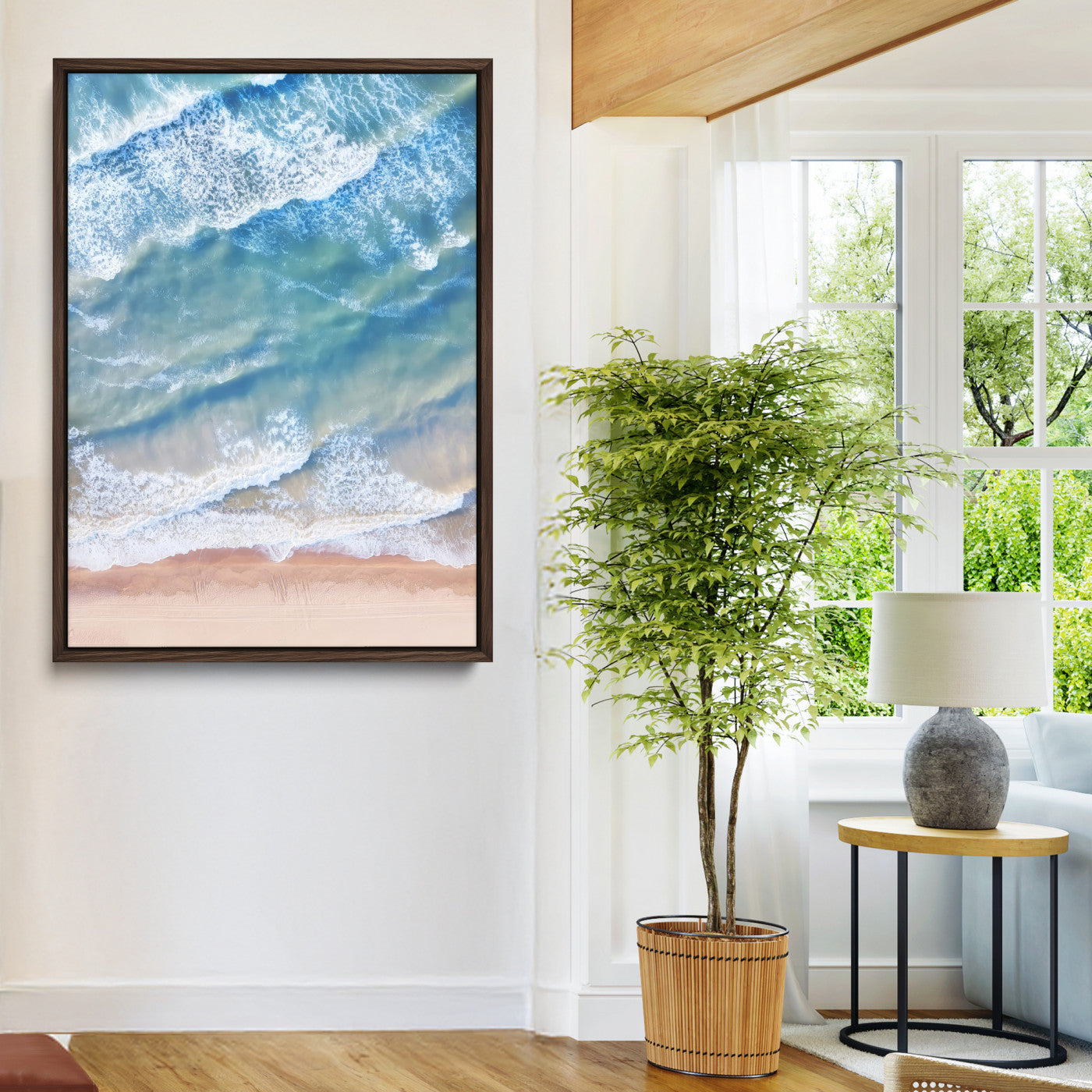 Aerial photo of soft blue waves meeting sandy shore, perfect for modern coastal or beach-themed decor with a light and tranquil aesthetic.