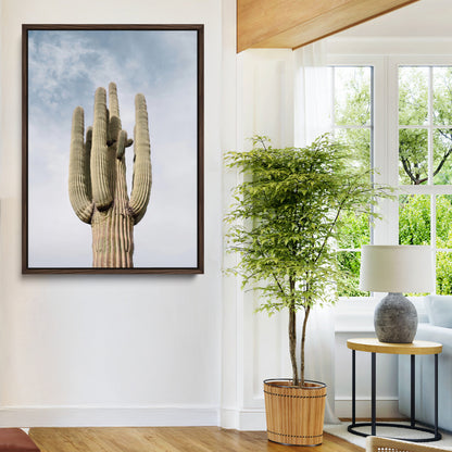 Vertical photo of a tall saguaro cactus against a soft sky, ideal for earthy or Southwestern home decor with warm neutral tones.