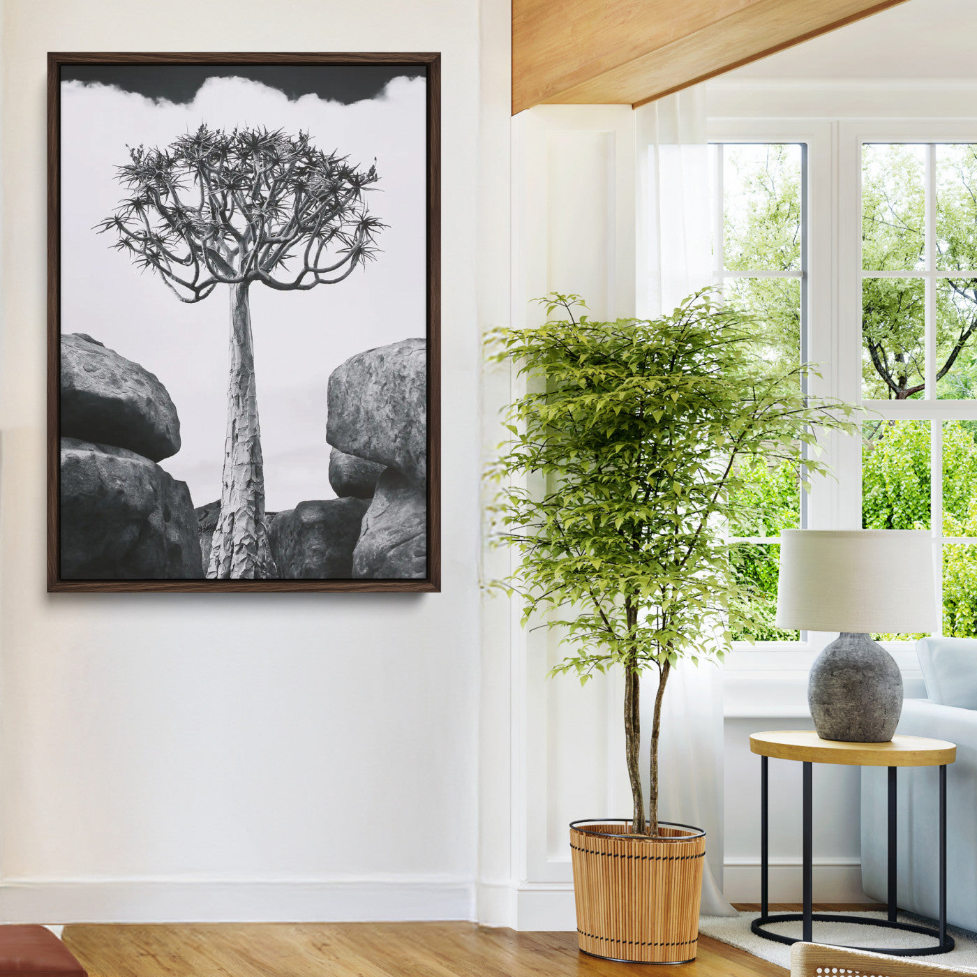 Tall desert tree in black and white, standing between large rocks, perfect for bold and minimalist nature-themed interior spaces.