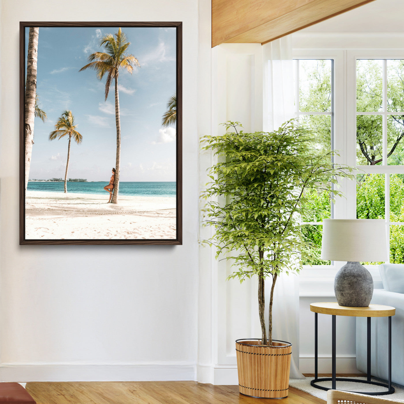 Person leaning on a palm tree at a tropical beach with white sand and turquoise water, perfect for coastal or beach-themed home decor.