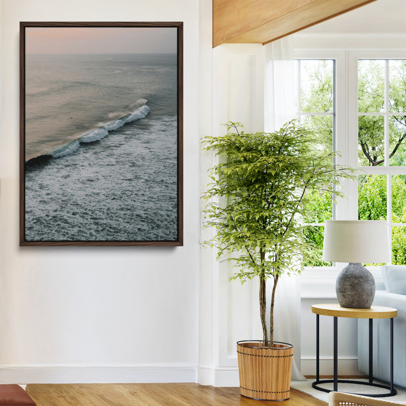 Aerial view of ocean waves rolling towards the shore under a soft sunset sky, creating a peaceful and minimalist coastal scene.