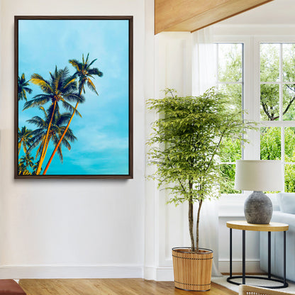 "Tall palm trees with golden sunlight against a vibrant blue sky, creating a tropical, relaxing atmosphere for coastal and beach-themed decor.