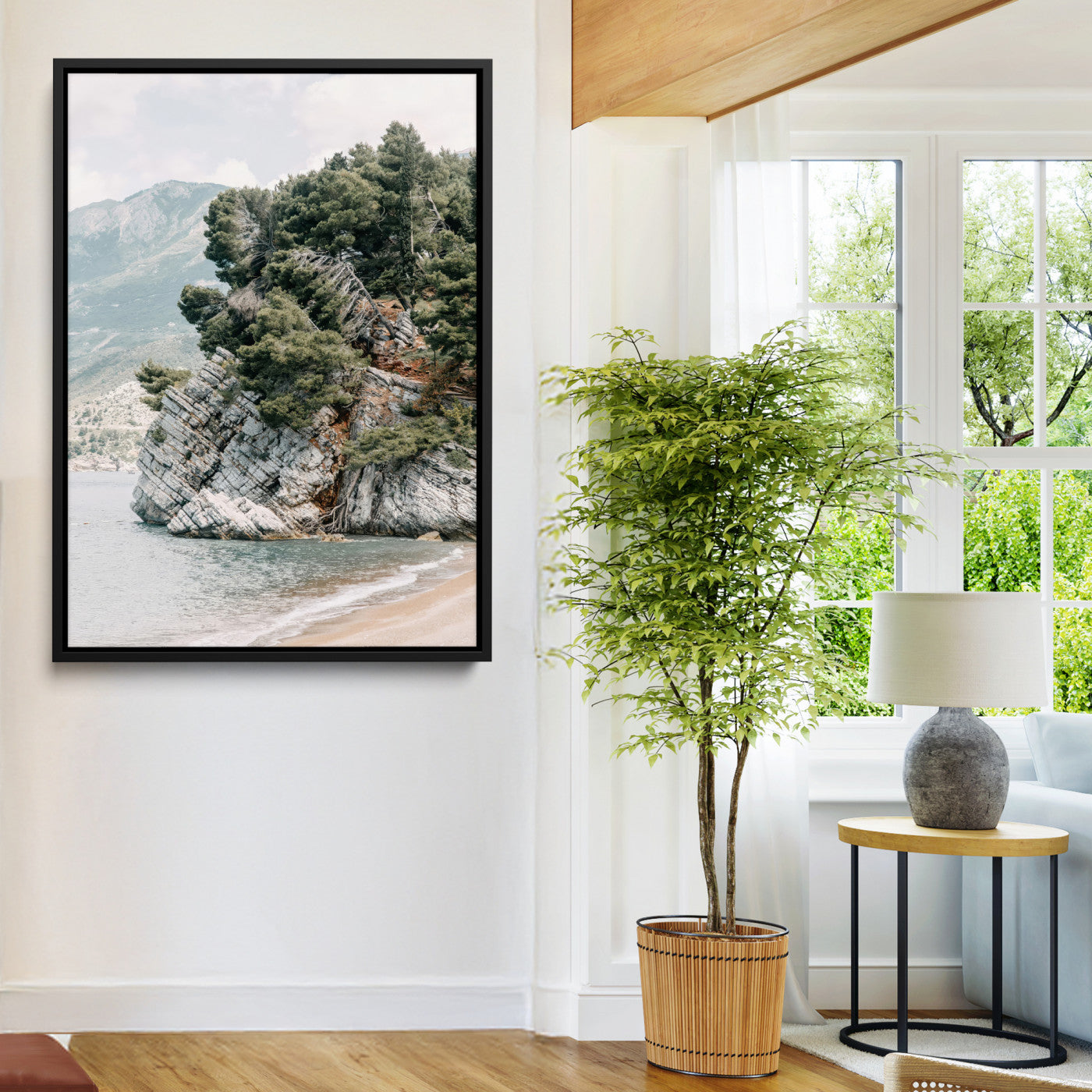 Framed photo of a rocky coastal cliff with dense greenery and calm shoreline, ideal for rustic coastal or earthy-toned home decor.
