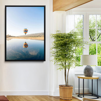 Canvas of a hot air balloon floating above a calm lake with soft reflections and vibrant sky, ideal for modern minimalist or adventure-themed home decor.