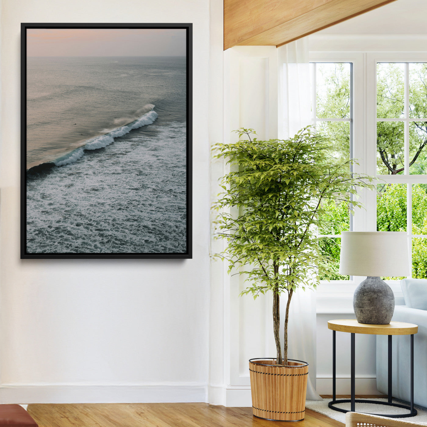 Aerial view of ocean waves rolling towards the shore under a soft sunset sky, creating a peaceful and minimalist coastal scene.