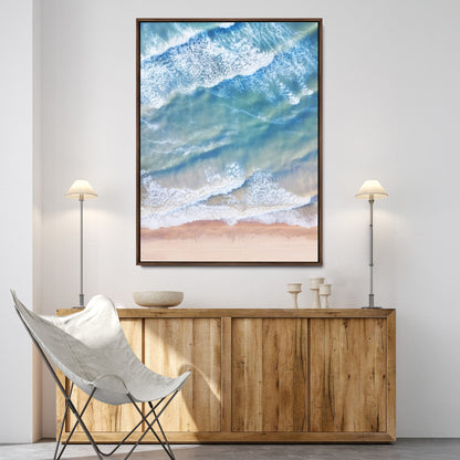 Aerial photo of soft blue waves meeting sandy shore, perfect for modern coastal or beach-themed decor with a light and tranquil aesthetic.