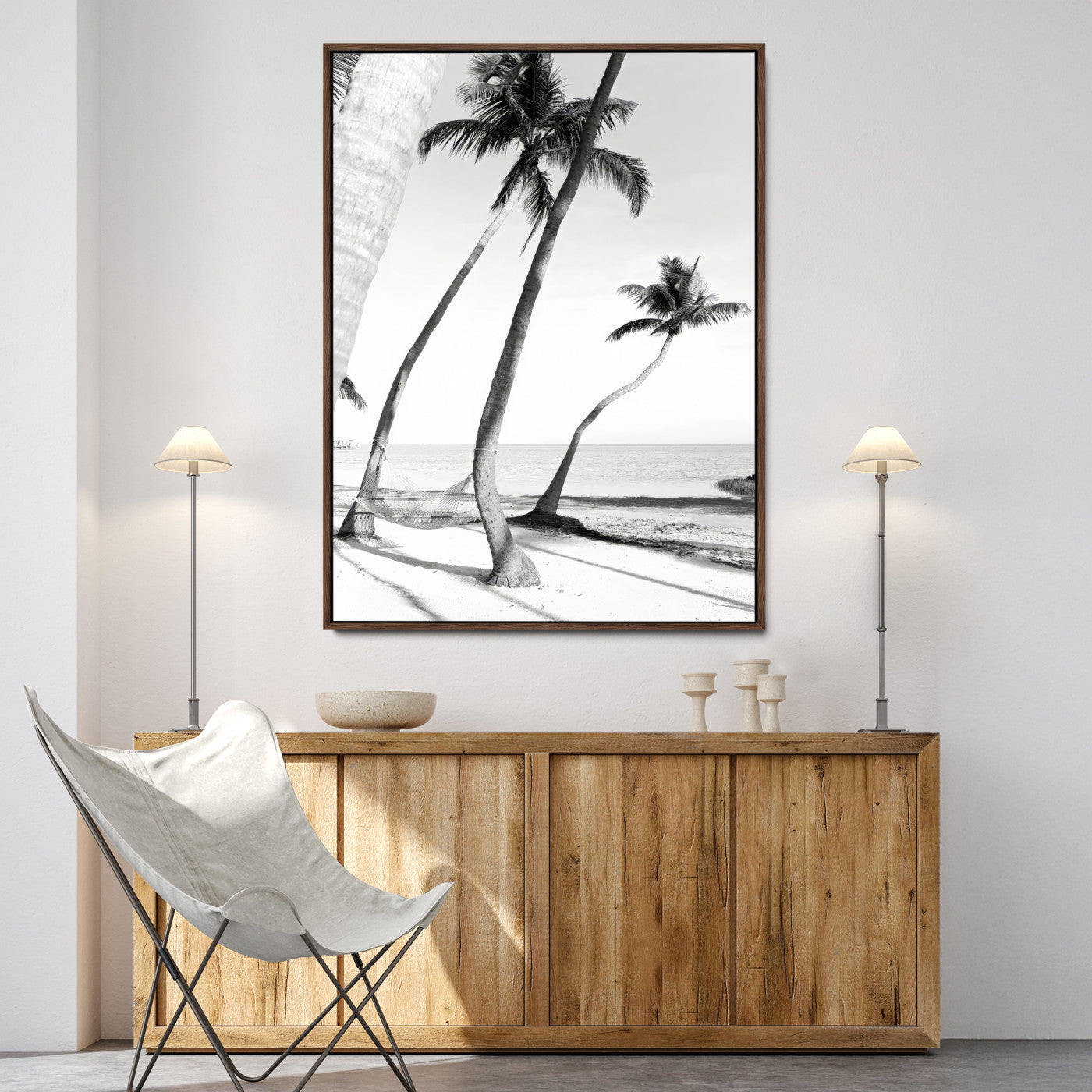 Black and white wall art of palm trees and a hammock on a beach, ideal for coastal minimalist or tropical-themed decor.