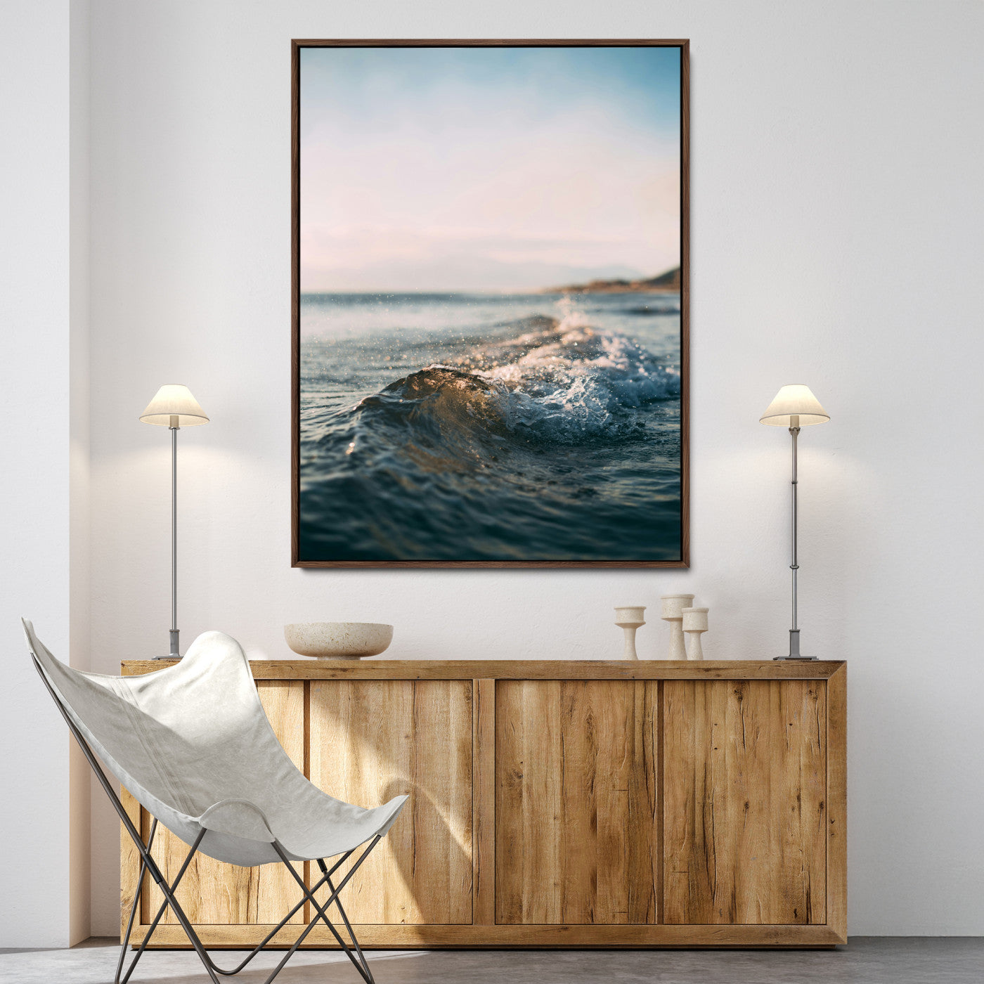 Close-up of ocean waves rolling gently toward the shore at sunset, creating a peaceful and minimalist coastal scene.