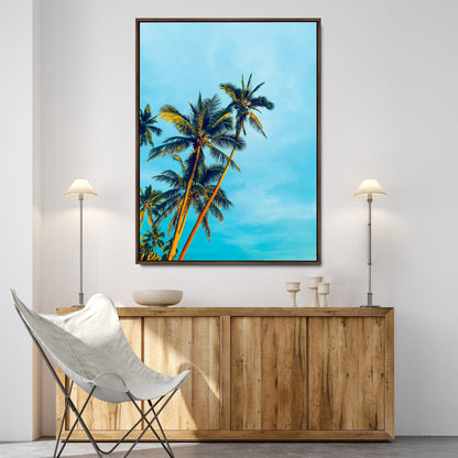 "Tall palm trees with golden sunlight against a vibrant blue sky, creating a tropical, relaxing atmosphere for coastal and beach-themed decor.