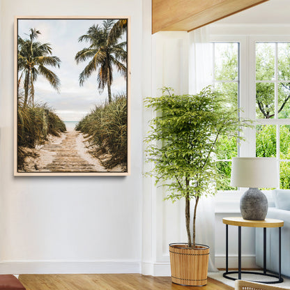 Canvas wall art of a tropical beach path with palm trees and dune grass, ideal for coastal entryways or tropical-inspired home decor.