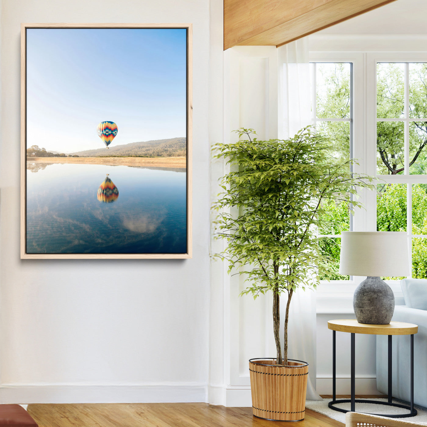 Canvas of a hot air balloon floating above a calm lake with soft reflections and vibrant sky, ideal for modern minimalist or adventure-themed home decor.