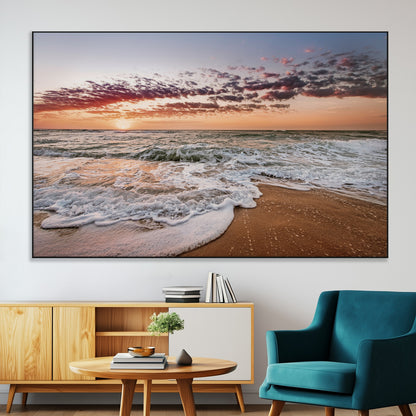 Canvas of a sunset over a foamy ocean shore with warm light and gentle waves, ideal for coastal or beach-themed home decor.