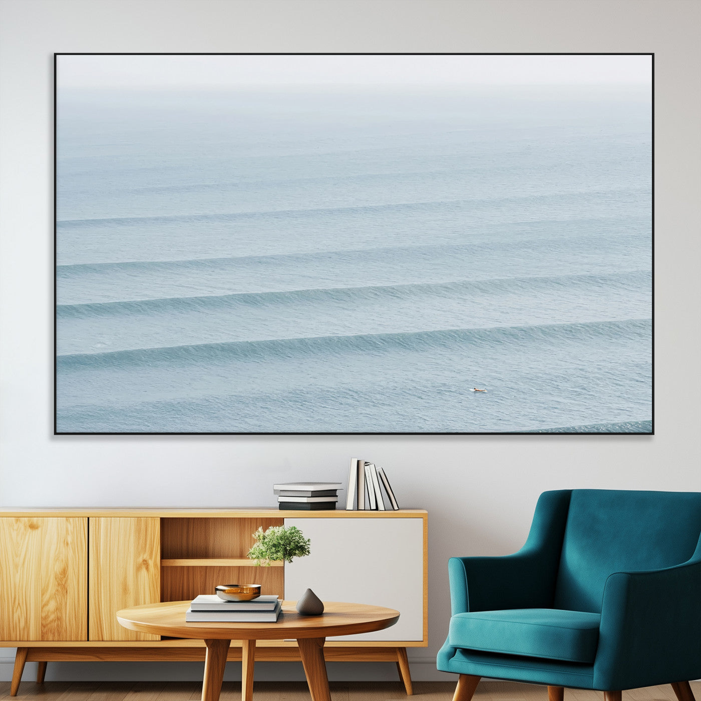Framed canvas of repeating ocean waves with a distant solo surfer, ideal for minimalist ocean or calm coastal wall decor.