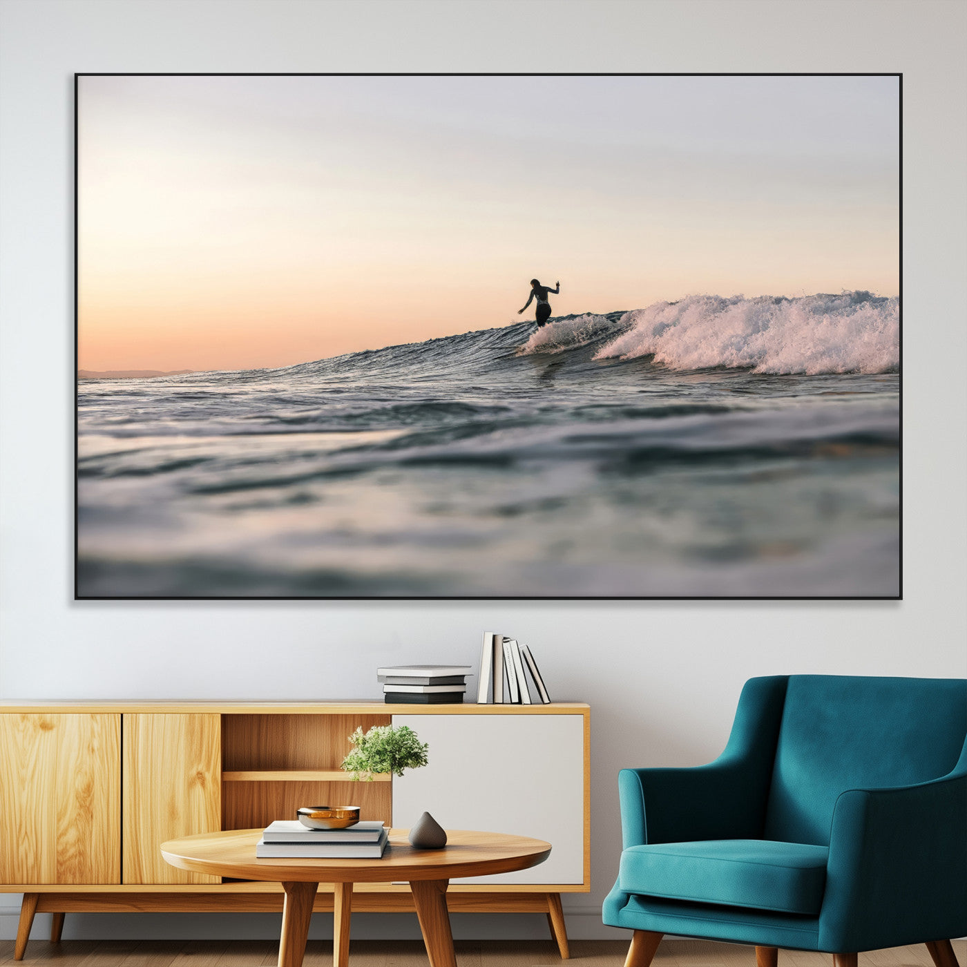 Framed canvas of a female surfer balancing on a wave at sunset, perfect for serene surf or ocean-inspired coastal decor.