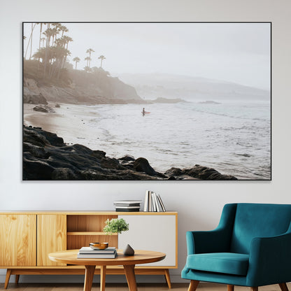 Framed canvas of a surfer in misty coastal tones at a foggy California beach, ideal for minimalist coastal beach or serene ocean-themed decor.