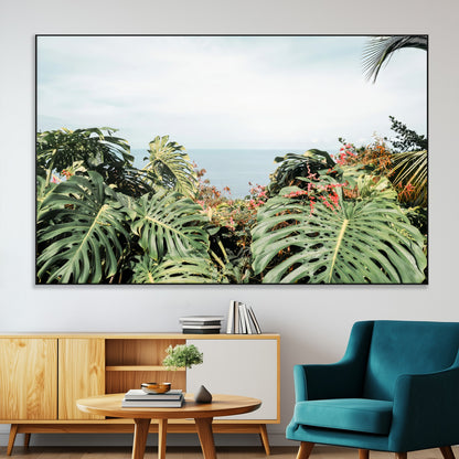 Monstera leaves and tropical flowers framing a calm ocean view, ideal for tropical coastal or exotic jungle-style interior wall decor.