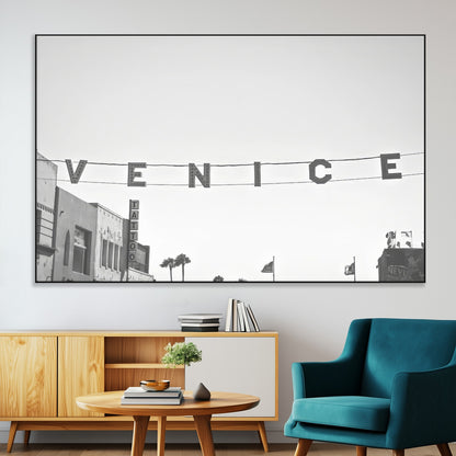 Black and white photo of Venice Beach sign and palm-lined street, perfect for urban coastal or minimalist LA-inspired wall decoration.