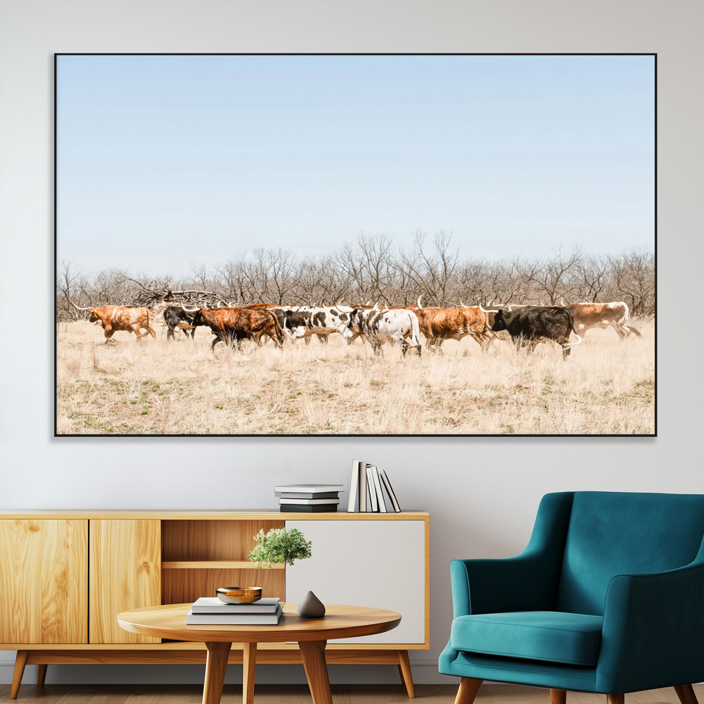 Framed wall art of Texas longhorn cattle walking through a dry, neutral-toned prairie, perfect for rustic farmhouse or western-themed home decor.