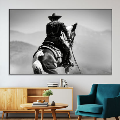 Black and white canvas of a cowboy on horseback with moody tones, perfect for rustic western or country-inspired home decor.