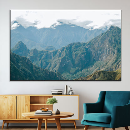 A misty mountain landscape with cloud-covered Andean peaks and lush green valleys, creating a dramatic and serene view, perfect for rustic or nature-inspired home decor.