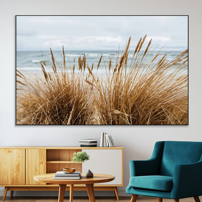 Canvas of golden beach grass swaying by the ocean under a soft cloudy sky, perfect for neutral-toned or coastal minimalist decor.