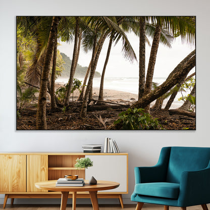 Dense tropical palm trees framing a sandy beach and ocean shore, ideal for jungle or coastal themed interior wall decor.