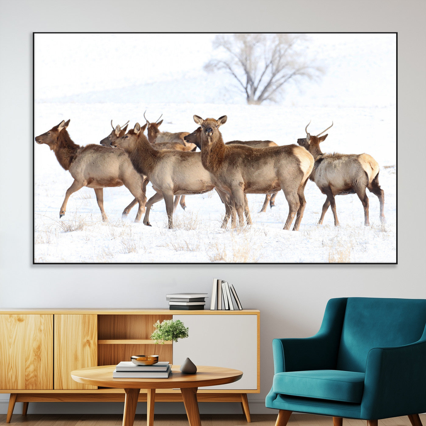 A group of elk standing on snowy terrain with a tree in the background, perfect for rustic or lodge-style winter wall decor.