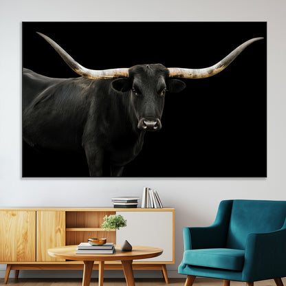 Close-up of a black Texas longhorn with large curved horns on black background, ideal for rustic farmhouse or modern western interiors.