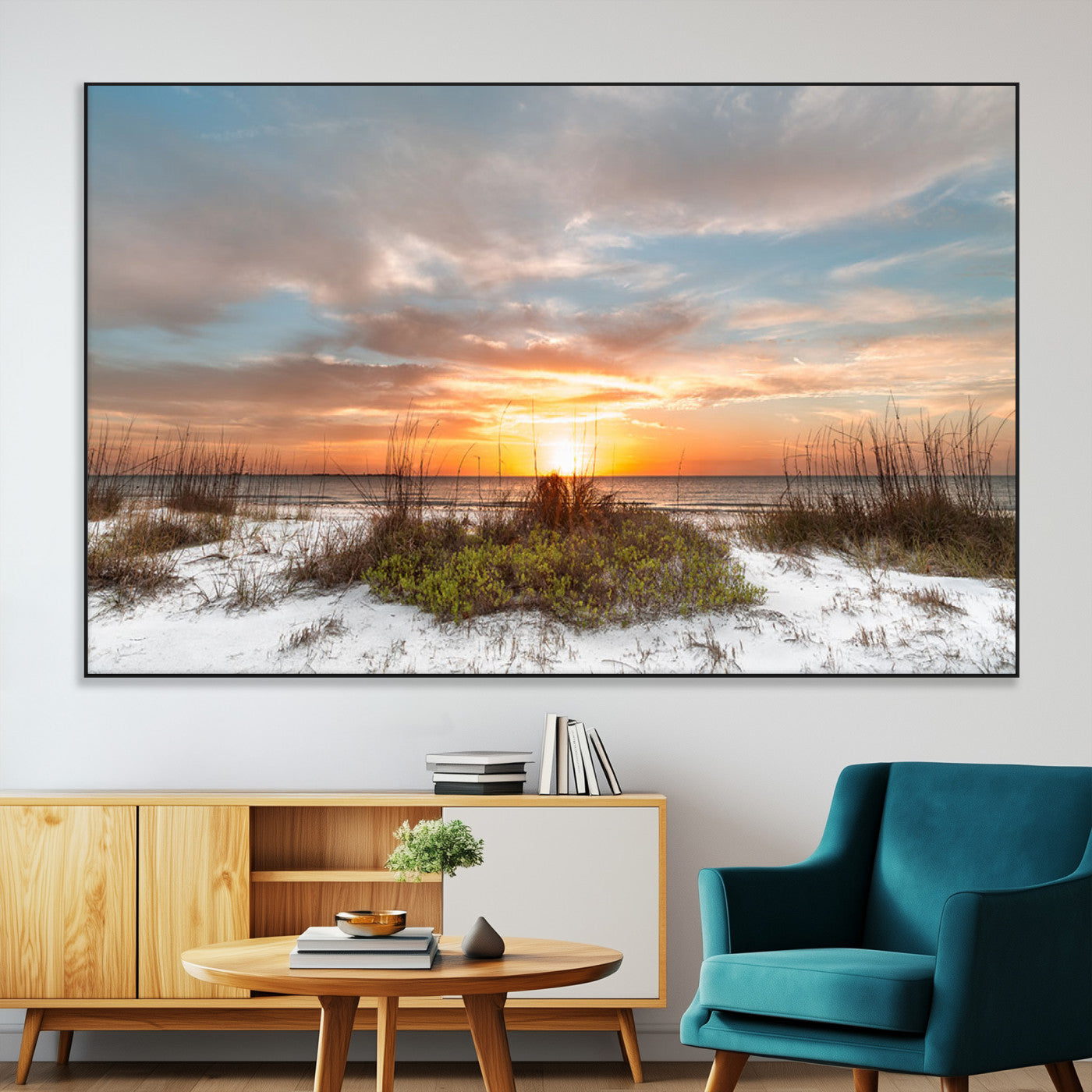 A tranquil beach scene featuring golden sunset hues over the water, with grasses in the foreground and a peaceful, serene atmosphere.