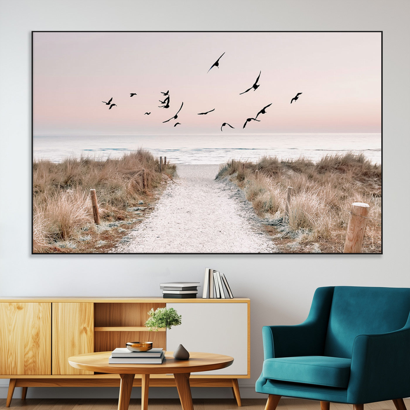 A peaceful coastal pathway leading to the ocean, with birds flying across a soft pastel sky, creating a calm and scenic beach atmosphere.
