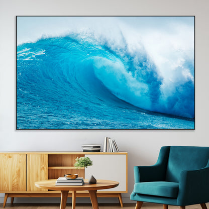 Vibrant canvas of a powerful curling ocean wave in tropical blue tones, perfect for coastal or surf-inspired decor settings.