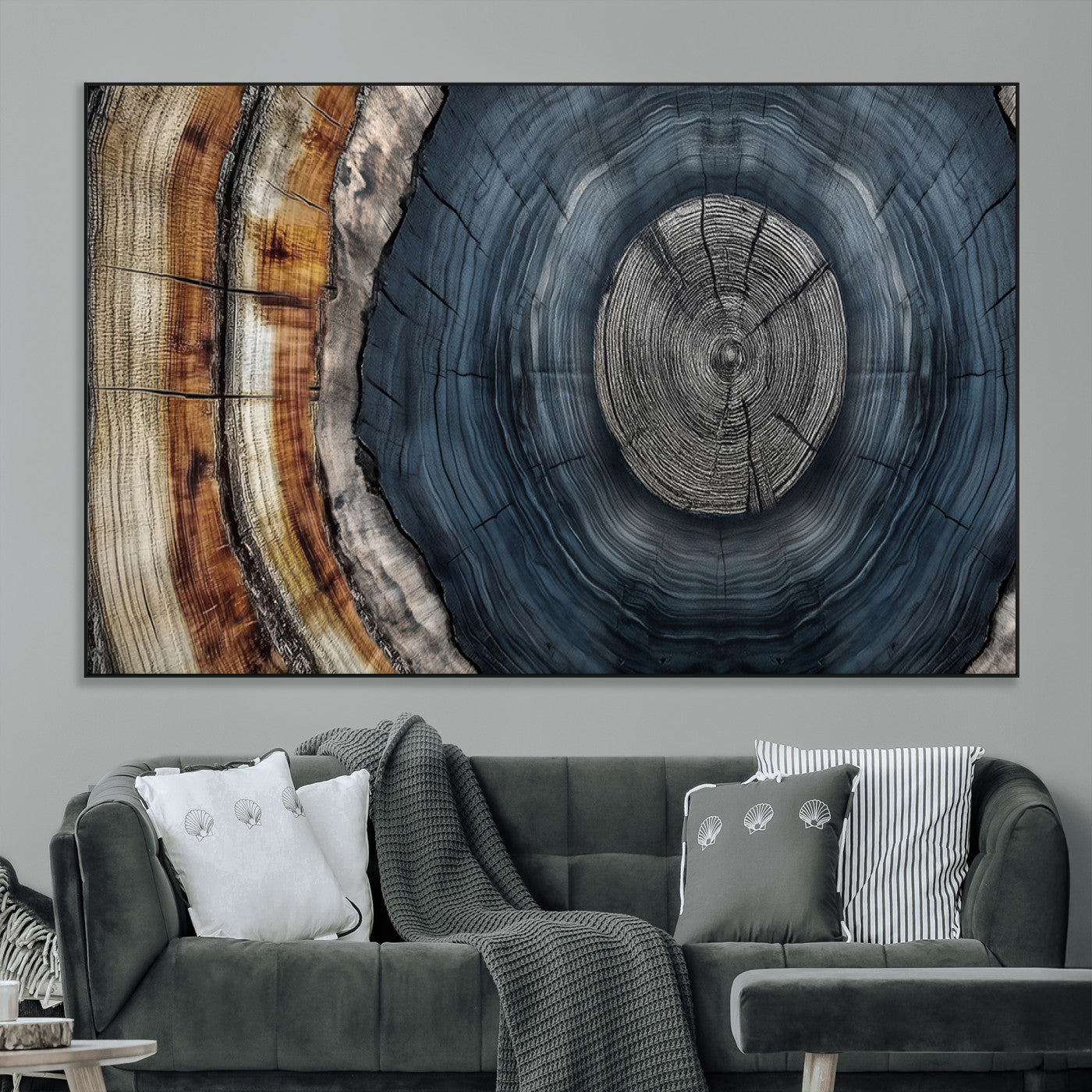 A stunning close-up of a tree trunk showing the intricate, circular growth rings, showcasing the natural textures and rich contrasts in deep blues, browns, and silvers.