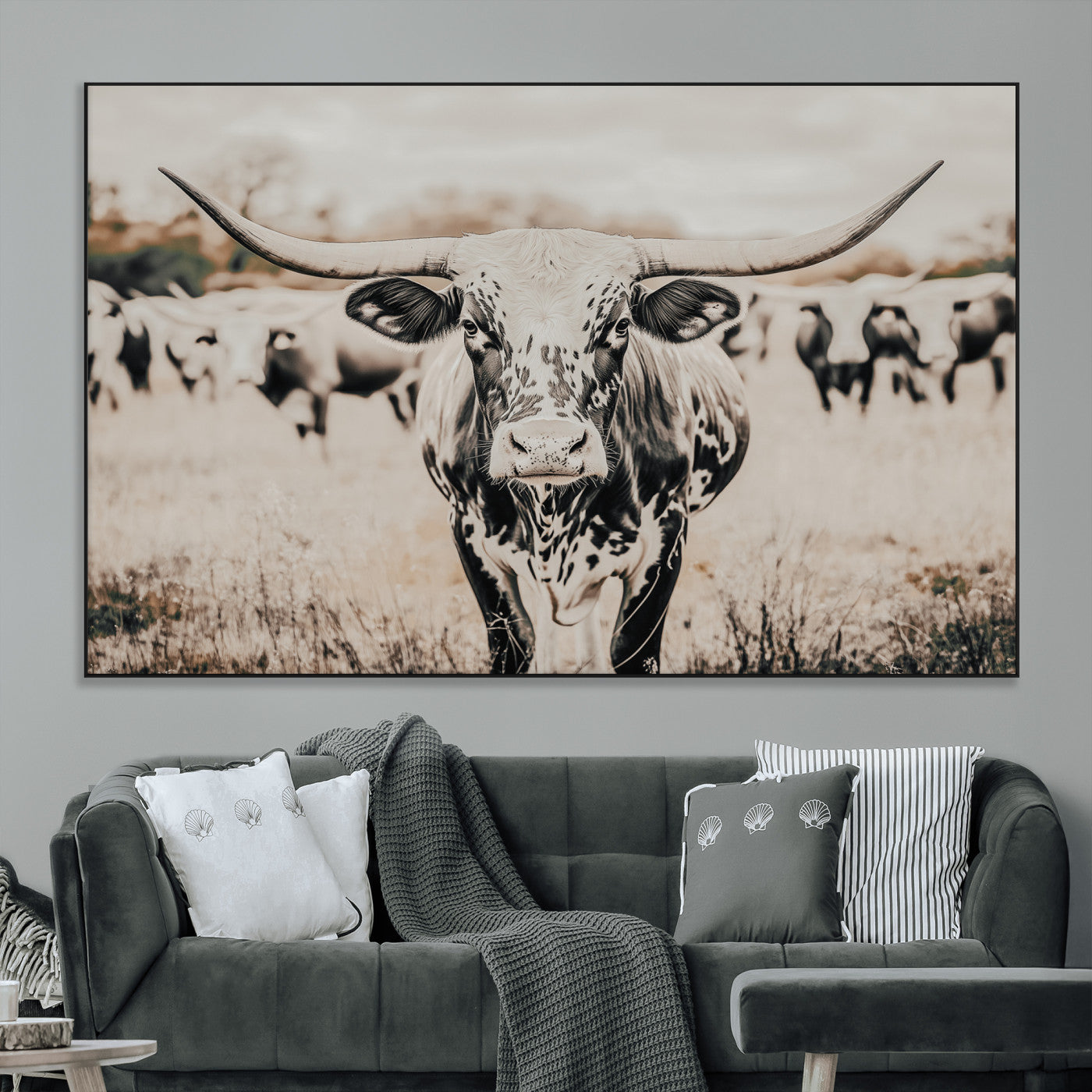Canvas of a speckled Texas longhorn standing boldly in a field with a herd behind, perfect for rustic western or farmhouse wall decor.