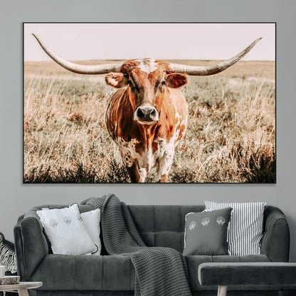 Framed longhorn cow canvas wall art with rustic prairie background, western animal print perfect for farmhouse or ranch style decor