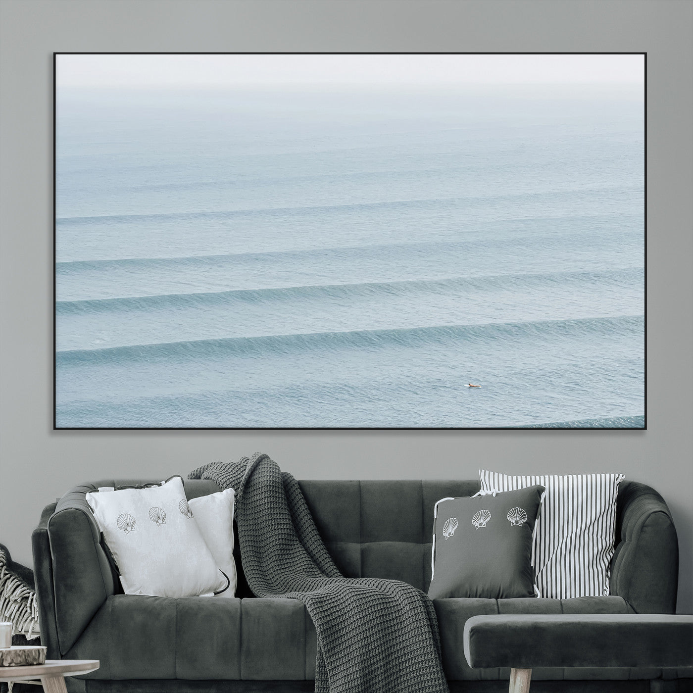 Framed canvas of repeating ocean waves with a distant solo surfer, ideal for minimalist ocean or calm coastal wall decor.