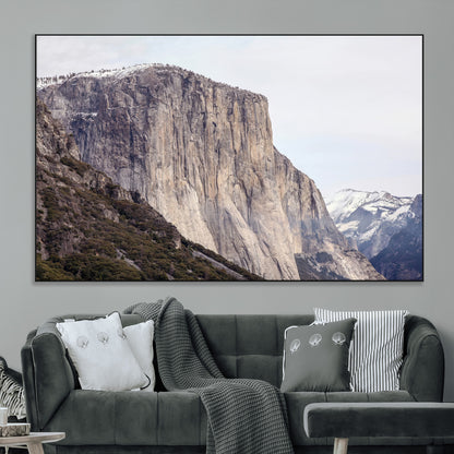 Framed canvas of El Capitan’s vertical granite face in Yosemite with snowy peaks, ideal for Sierra minimalism or mountain-inspired decor.