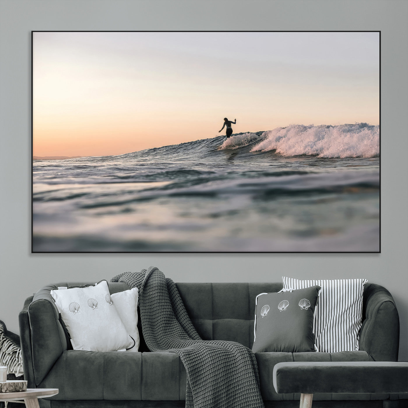 Framed canvas of a female surfer balancing on a wave at sunset, perfect for serene surf or ocean-inspired coastal decor.