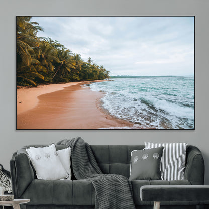 Framed canvas of a tropical beach with palm trees and soft waves, ideal for coastal escape or serene nature-inspired home decor.