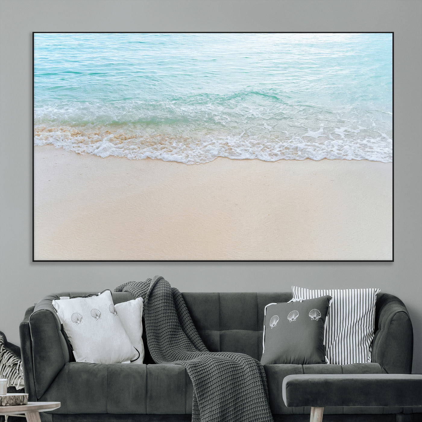 Soft shoreline with gentle aqua waves on smooth sand, ideal for minimalist coastal or pastel ocean-inspired home wall decor.